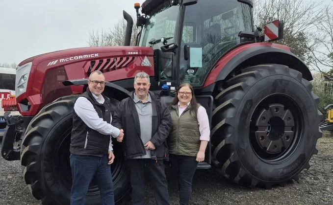 Customers with a McCormick tractor